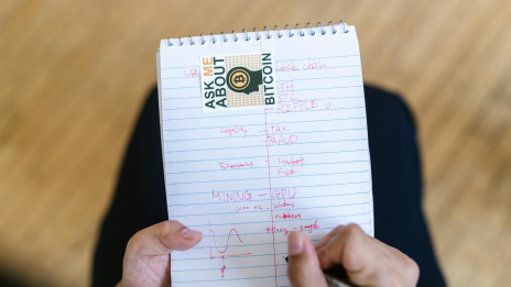 person holding white ruled paper